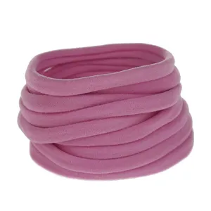 Close-up detail of soft pink elastic nylon hair bands for DIY baby hair accessories.