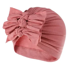 Soft ribbed knit baby turban hat with cute double bow design, perfect for infants spring wear.