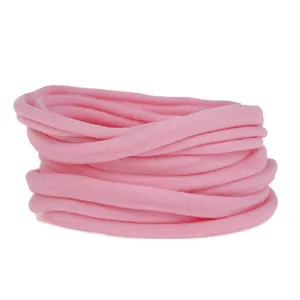 Detail shot of soft pink elastic nylon hair bands, perfect for baby DIY headbands and accessories.