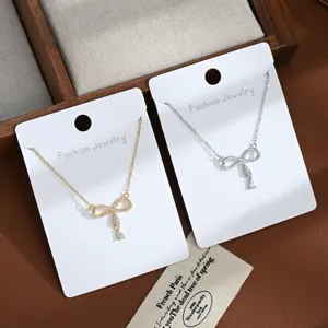 Exquisite bow micro-inlaid zircon clavicle chain, delicate double-color necklace for daily wear.