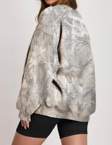 Women's loose crewneck sweatshirt featuring a realistic tree branch camouflage print design.