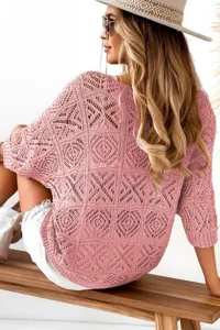 Pink V-neck hollow knit sweater with 3/4 sleeves, loose beach cover-up detail shot.