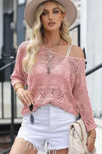 Pink hollow out crochet off shoulder sweater detail showing delicate knit texture.