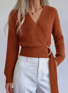 Women's V-neck knit sweater with metal ring belt, long sleeve wrap design detail view.