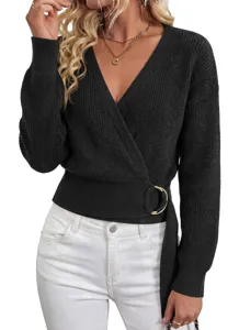 Black knit sweater detail featuring a chic wrap front, deep V-neck, and gold metal ring accent.