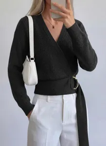 Detail view of women's black V-neck wrap knit sweater featuring a stylish metal ring buckle.