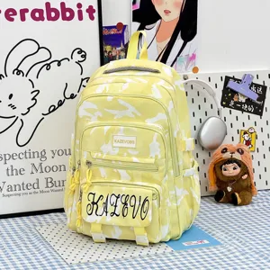 Large capacity canvas backpack for women, stylish yellow camouflage school book bag casual travel.