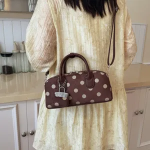 Brown polka dot shoulder bag, stylish crossbody boston bag with cute lock pendant.