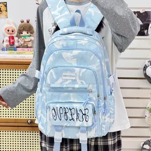 Light blue camouflage student backpack, large capacity school bag for daily commute and travel.