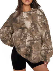 Detailed view of the women's camo crewneck sweatshirt featuring a realistic tree branch print.