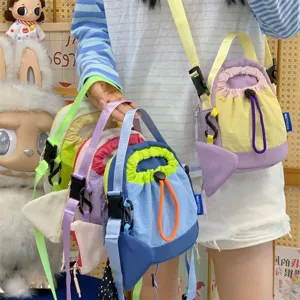 Korean style casual fashion crossbody bag with drawstring design and vibrant color blocks.