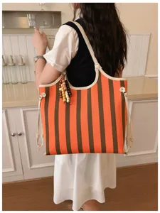 Elegante borsa shopper a righe arancione marrone in tela da donna, grande borsa a spalla.