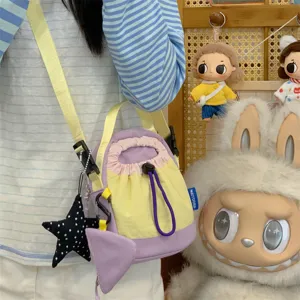 Korean style casual canvas crossbody bag with cute star pendant and spacious compartment.