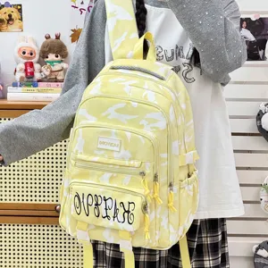 Cute yellow camo backpack for women, large capacity student school bag, casual travel daypack.