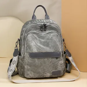 Zaino in tela grigia lavata con scomparti con zip e tracolla dal design etnico.