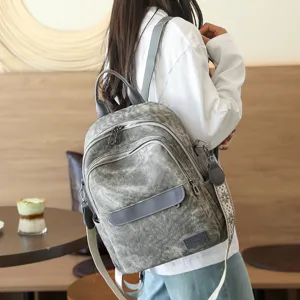 Zaino stile coreano in tela lavata vintage vista dettagliata con tasche multiple.