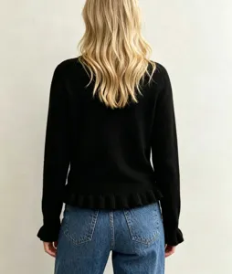 Solid color round neck long sleeve pullover knit sweater featuring stylish ruffle hem details.
