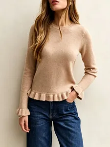 Close-up detail of a chic camel crewneck knit sweater featuring elegant ruffled hem and cuffs.