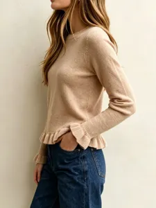 Detailed view of women's chic beige knit sweater featuring elegant ruffle hem and sleeves.