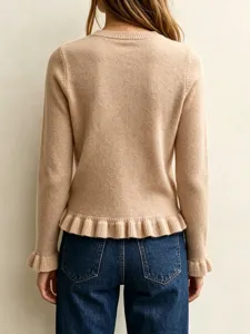 Back view detail of women solid round neck long sleeve knit sweater with ruffled hem cuffs.