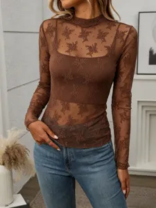 Close-up detail of brown sheer mesh long sleeve top, mock neck design, soft fabric texture.