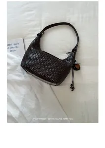 Woven leather hobo shoulder bag for women, stylish minimalist retro dumpling handbag.