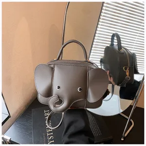 Cute cartoon elephant shape handbag, creative small PU leather crossbody shoulder bag for women.