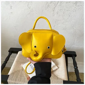 Cute yellow elephant shape PU leather handbag detail view, unique crossbody bag design.