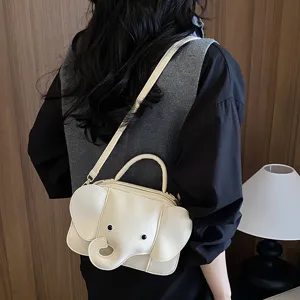 Cute elephant shaped crossbody bag for women, creative cartoon design PU leather shoulder purse.