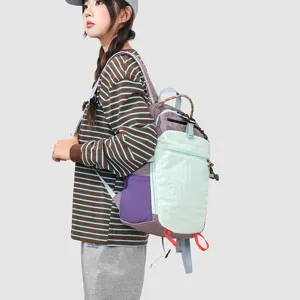Outdoor hiking backpack detail shot, multi-pocket design, stylish color blocking for travel.