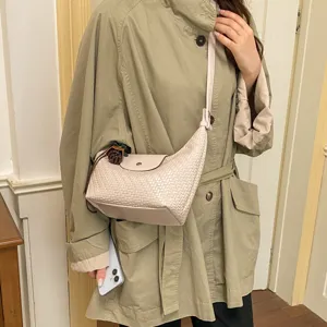 Woven leather underarm shoulder bag for women, chic dumpling crossbody commuter handbag.