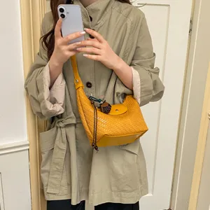 Stylish yellow woven hobo shoulder bag, trendy dumpling crossbody bag for women daily commute.