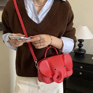 Cute red elephant shape crossbody handbag for women, creative novelty cartoon shoulder bag.