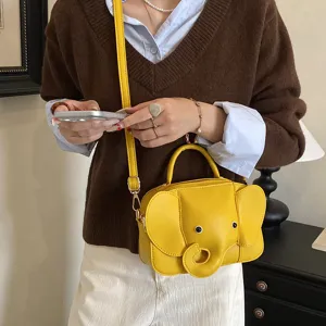 Cute yellow elephant crossbody bag for women, stylish cartoon PU leather shoulder handbag.