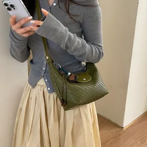 Olive green woven hobo shoulder bag for women, stylish leather dumpling crossbody bag.