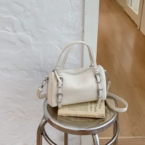 Borsa a mano cilindrica crema minimalista ed elegante, borsa a tracolla versatile per donna.