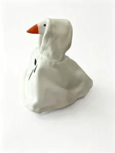 Close-up detail of the cute white goose plush toy wearing a spooky Halloween ghost cloak.