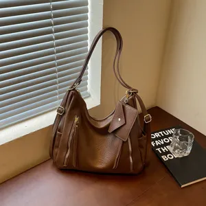 Brown PU leather hobo shoulder bag with large capacity, dual zippers and side pockets.