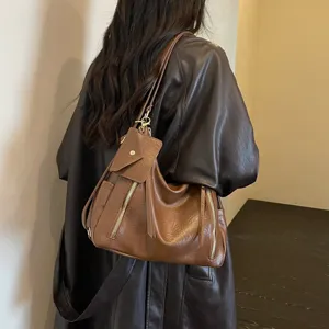 Stylish brown leather shoulder bag for women, large capacity multi-pocket commute tote design.