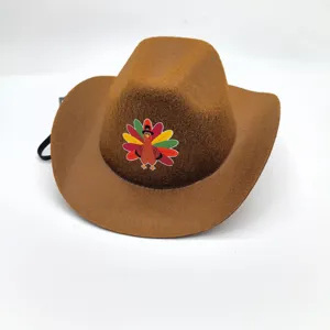 Brown felt Thanksgiving cowboy hat with colorful turkey print and elastic chin strap.