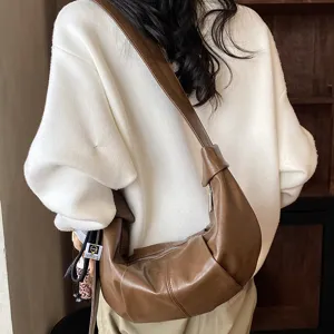 Bruine lederen schoudertas voor dames, retro casual crossbody dumpling tas met grote capaciteit.