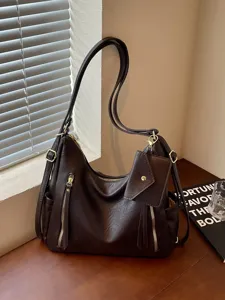 Women large capacity tote bag versatile casual shoulder bag vintage commuter backpack.