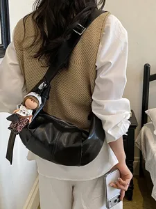 Casual zwarte lederen crossbody dumpling tas, vintage slouchy grote schoudertas.