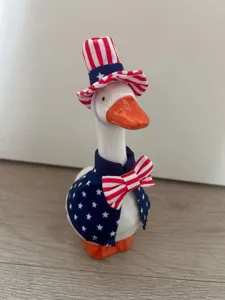 Detailed view of 7-inch ceramic goose figurine with US Independence Day patriotic outfit set.