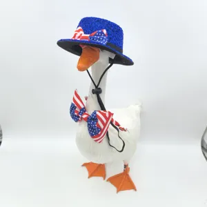 Detailed close-up of a decorative goose wearing a blue sequin hat and patriotic US flag bow tie.