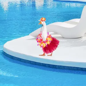Detail shot of tropical pet goose costume set featuring a vibrant flower garland and red tutu skirt.