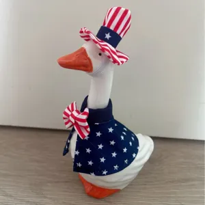 7 inch ceramic goose figurine with patriotic USA star stripes hat and cape for table decor.