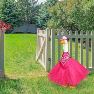Detailed shot of pink goose costume set featuring tutu skirt, bandana and sparkly hat.
