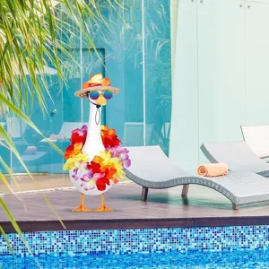 Summer beach porch goose decoration with tropical garland and straw hat set for detail view.