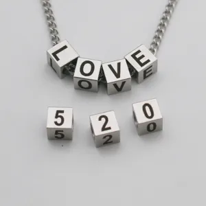Stainless steel cube letter beads and chain detail, perfect for custom DIY jewelry making.